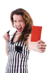 Woman referee showing a red card